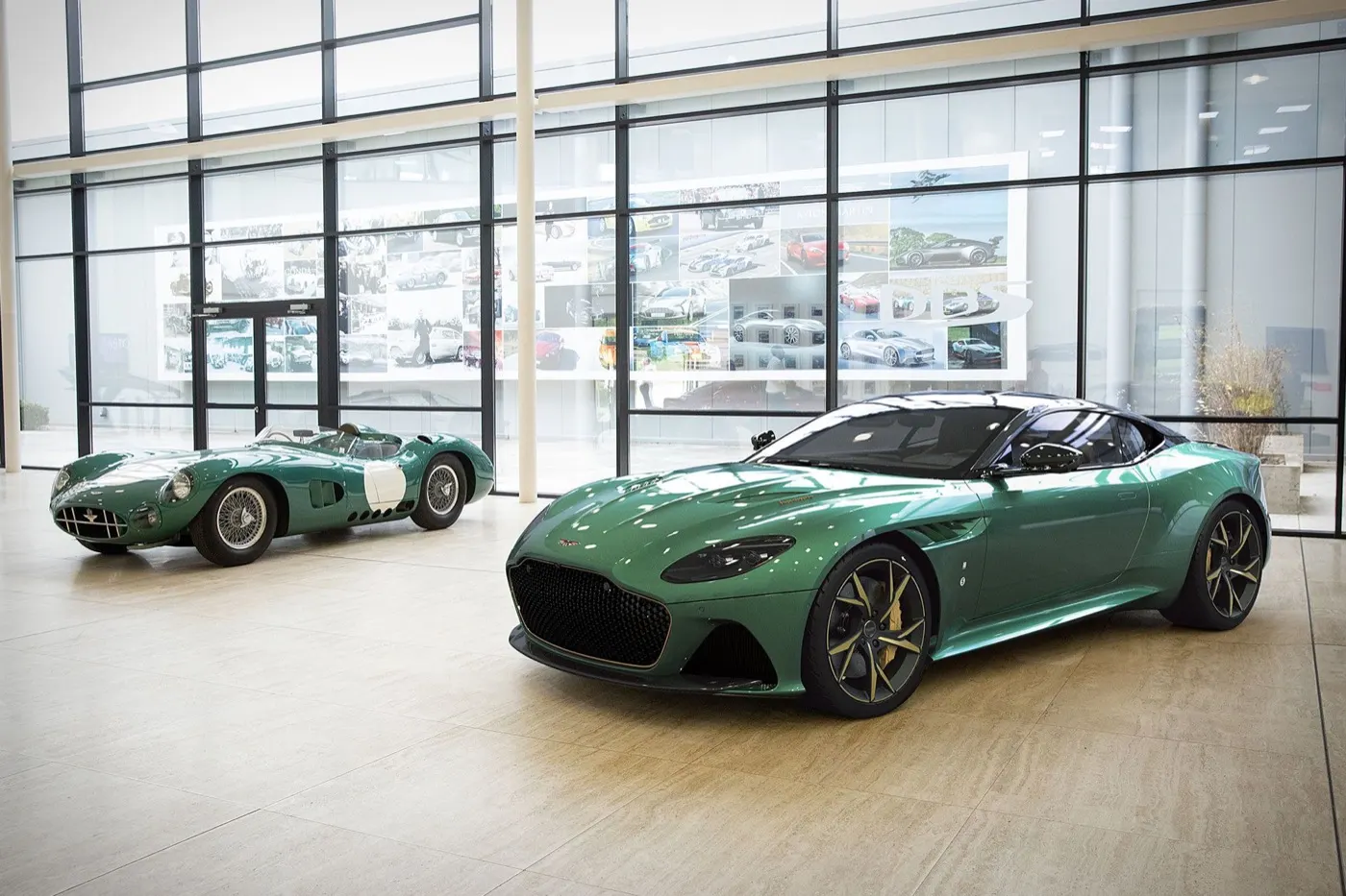 Aston Martin DBS 59 next to its racing ancestor in a glass hall