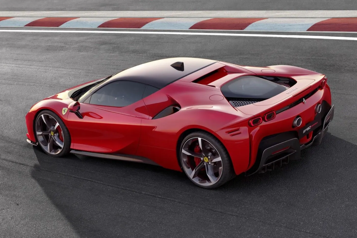Red Ferrari SF90 Stradale on a race track