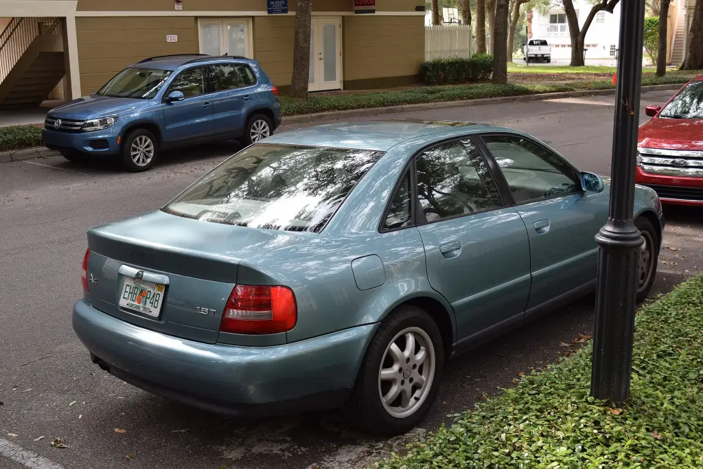 Blue Audi A4 B5 saloon with the facelift front