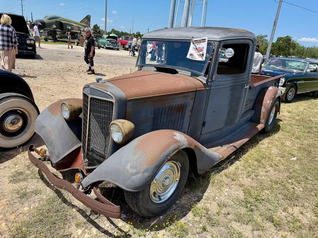 Weathered 1936 International Harvester C-1 pickup truck at a car show