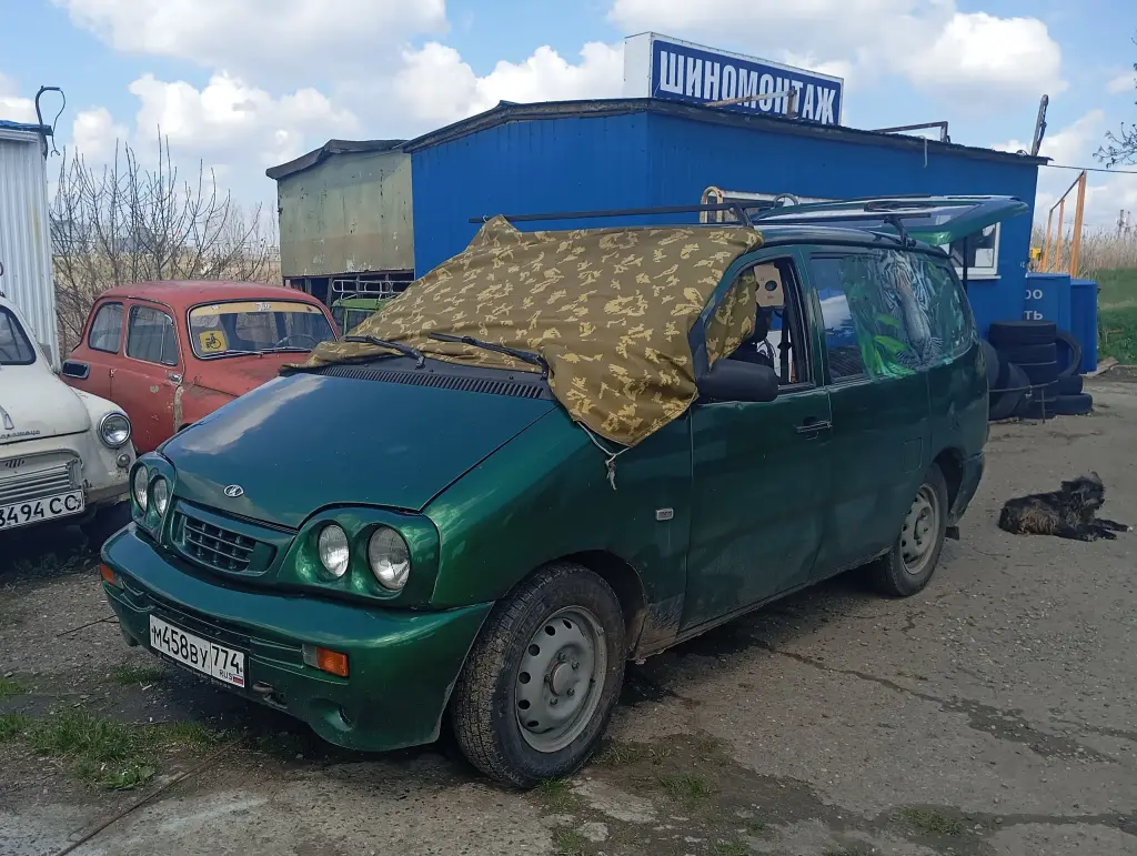 Green Lada 2120 minivan