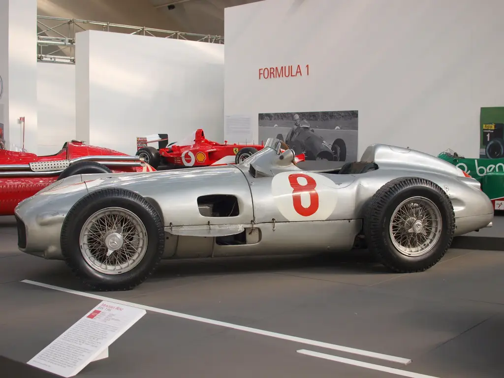 Silver Mercedes-Benz W196 Formula One car, number 8, in a museum