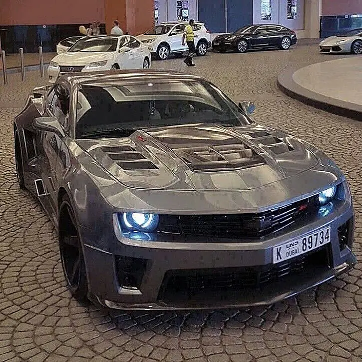 Grey widebody Chevrolet Camaro ZL1 in front of a shopping centre