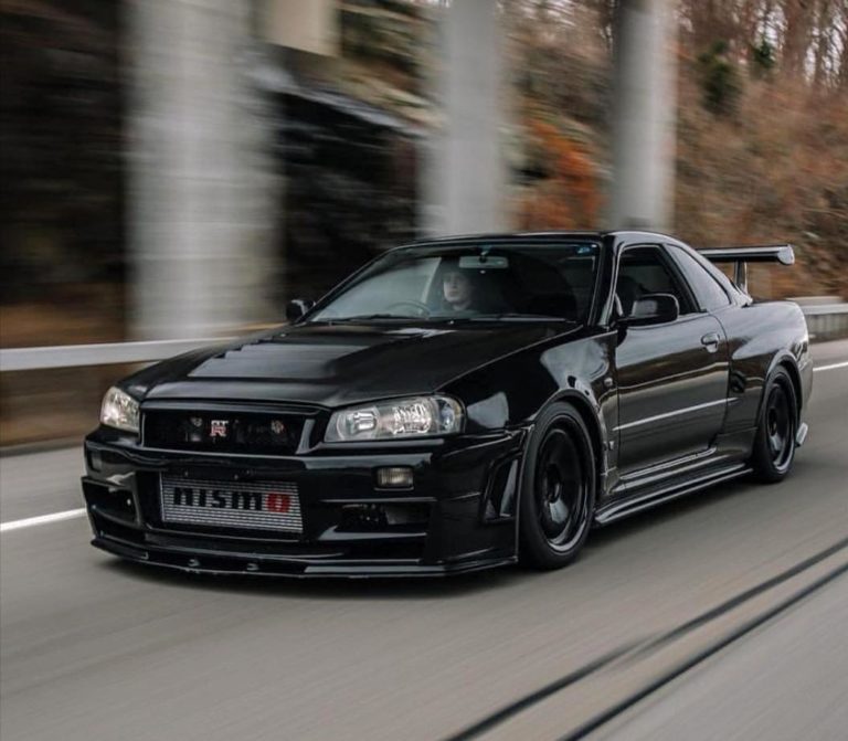 Gorgeous Black Nissan Skyline R34 GT-R running on road pictures ...