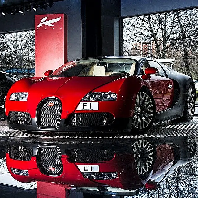 Red and black Bugatti Veyron in a showroom