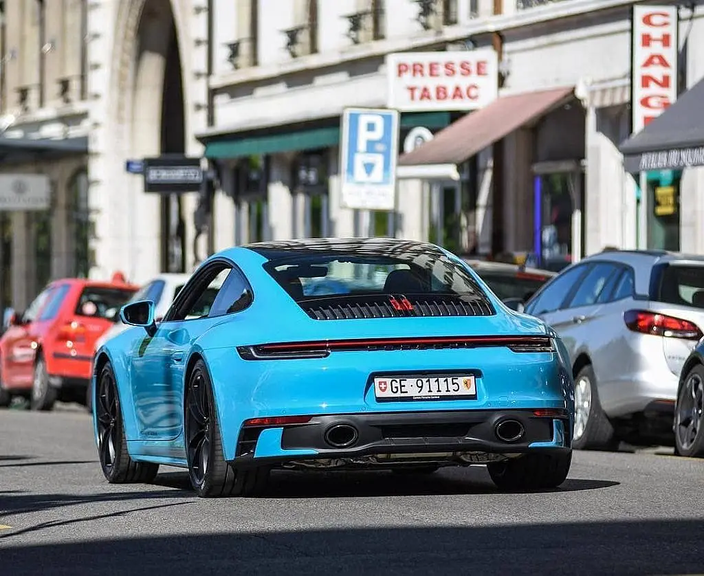 Light blue Porsche 911 (992) in a French street