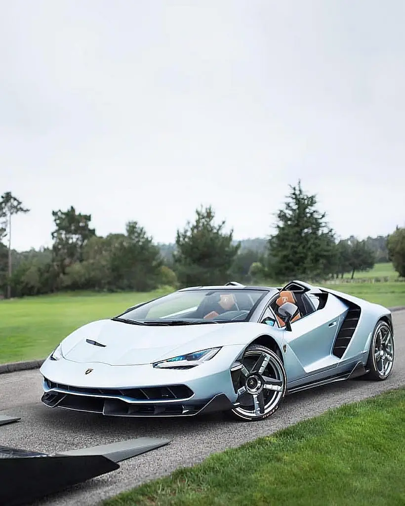 White Lamborghini Centenario Roadster on a lawn