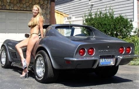 cute women leaning on a   64 Corvette chevy