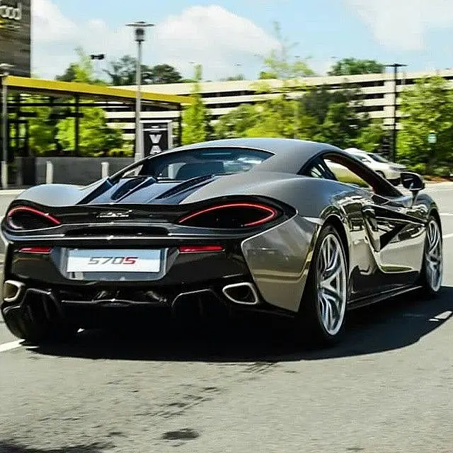 Grey McLaren 570S from behind on a city street