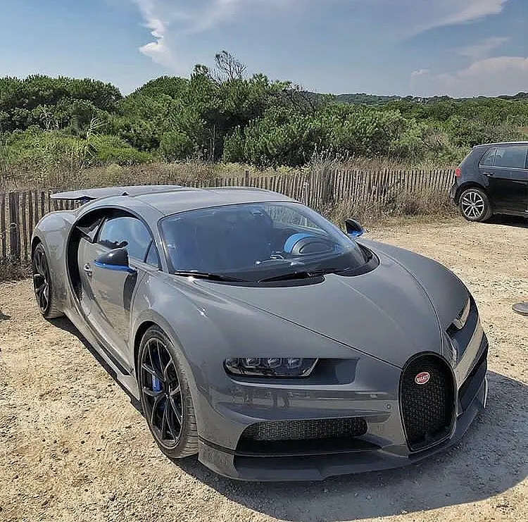 Matte grey Bugatti Chiron on a coast road