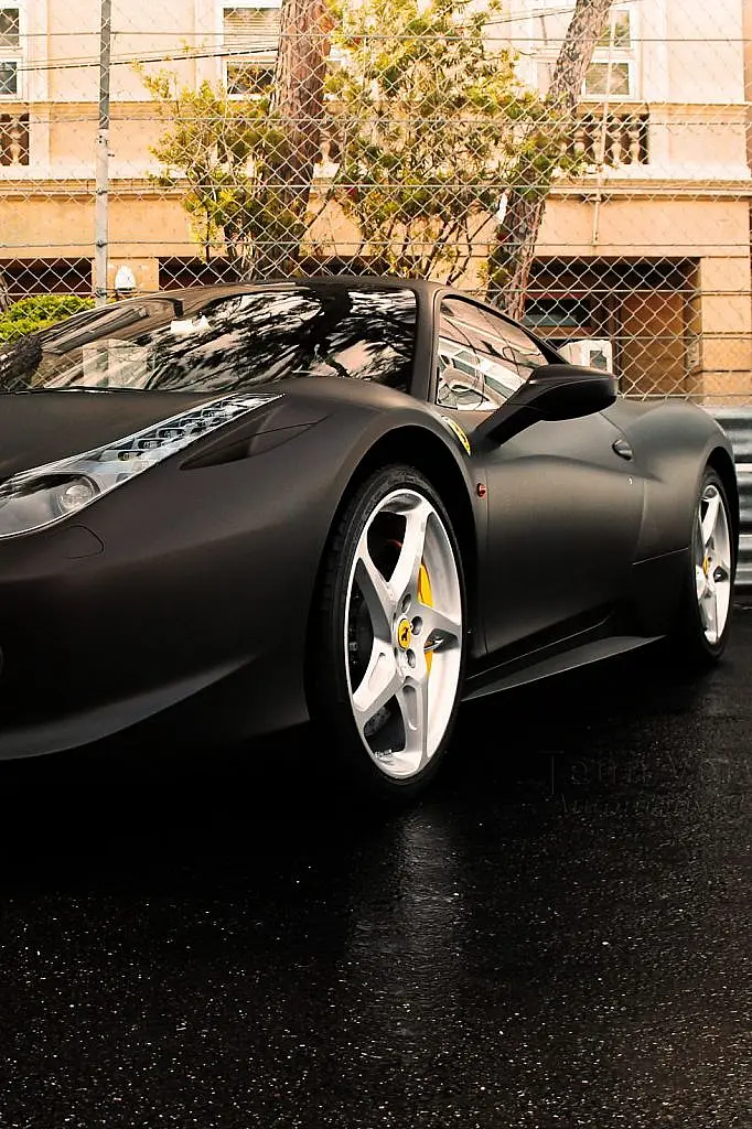 Black Ferrari roadster, front wheel detail