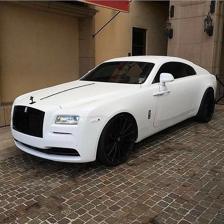 White Rolls-Royce Wraith on cobblestones