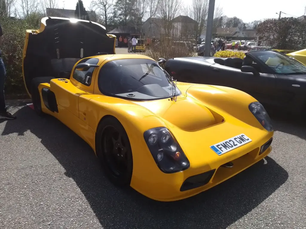 Yellow Ultima GTR with its rear bodywork raised