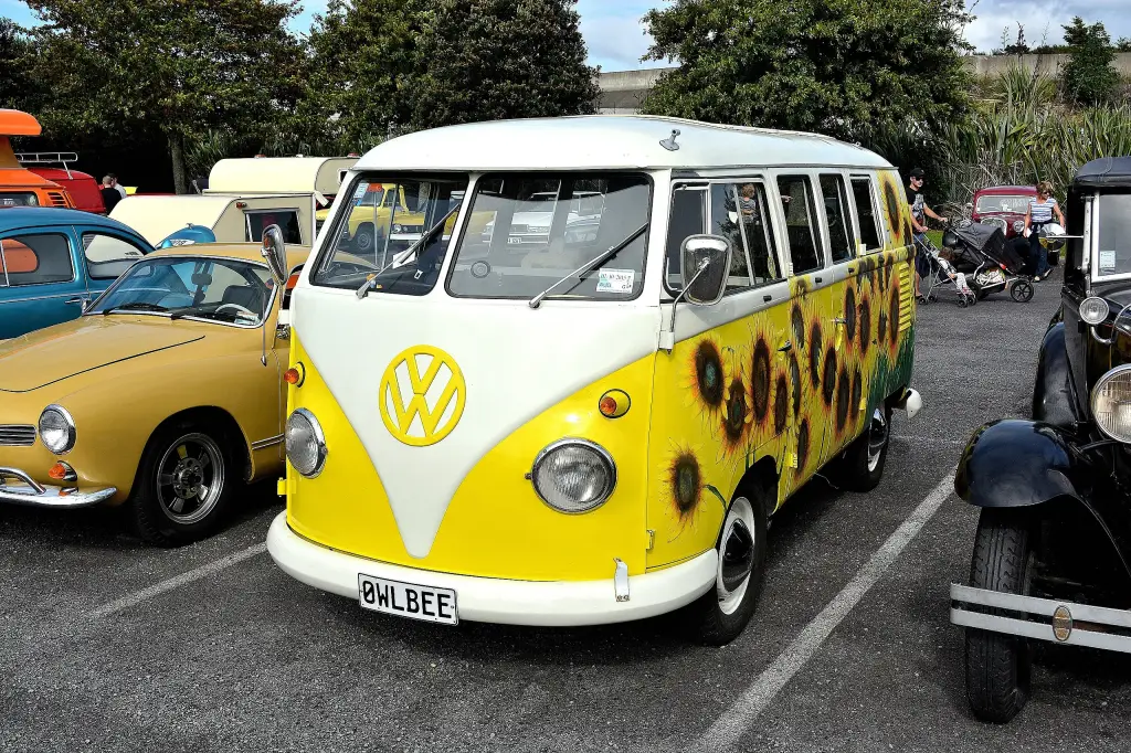 1961 Volkswagen Kombi in yellow and white with sunflowers painted on the side